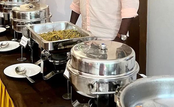 Buffet setup with stainless steel chafing dishes