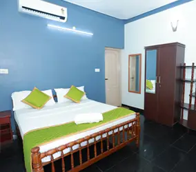 ideal ayurvedic resort bed room 2
