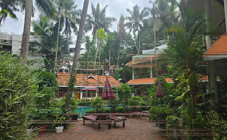 Peaceful Ayurvedic resort with traditional tiled roof cottages