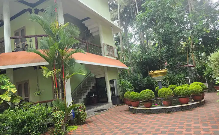 Ayurvedic resort building with garden and outdoor plants